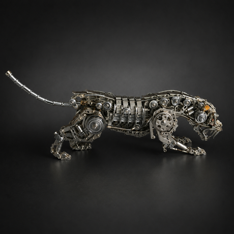 Articulated mechanical panther displayed in a hunting crouch
