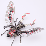 A steampunk beetle sculpture made of metallic parts, featuring silver mechanical wings, a black and silver beetle body, and red internal gears and tubes, photographed on a clean white background.