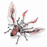 A highly detailed, steampunk-style mechanical insect sculpture made of metallic silver parts, black gears, and vibrant red accents, set against a solid white background.